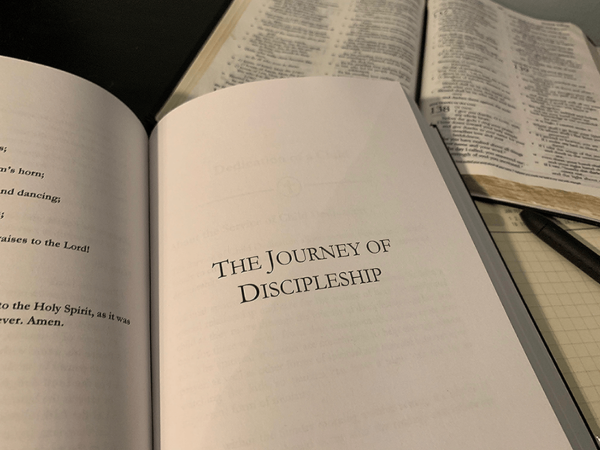 open bible, A Book of Prayer for Baptists open to The Journey of Discipleship